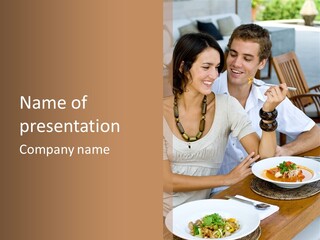 A Man And Woman Sitting At A Table Eating Food PowerPoint Template