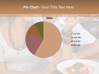 A Man And Woman Sitting At A Table Eating Food PowerPoint Template