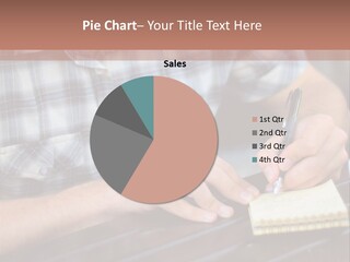 A Man Writing On A Piece Of Paper With A Pen PowerPoint Template