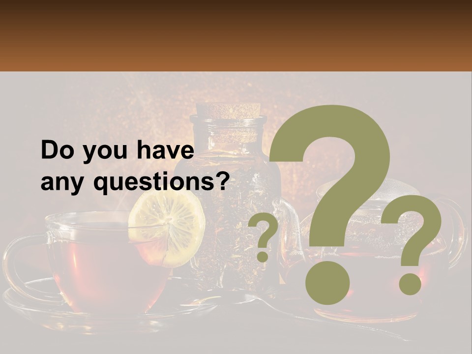 A Cup Of Tea Next To A Teapot With A Lemon On It PowerPoint Template