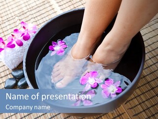 A Woman's Feet In A Bowl Of Water With Pink Flowers PowerPoint Template