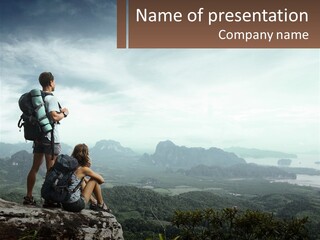 A Couple Of People Sitting On Top Of A Mountain PowerPoint Template