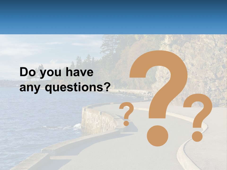 A Paved Road Next To A Body Of Water PowerPoint Template