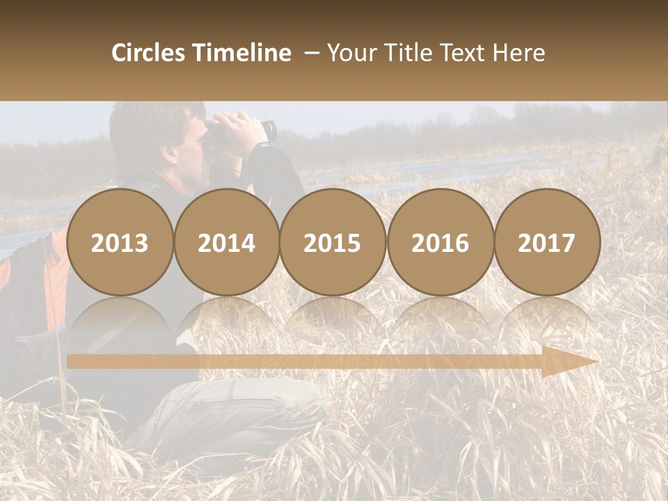 A Man Sitting In A Field Looking Through Binoculars PowerPoint Template