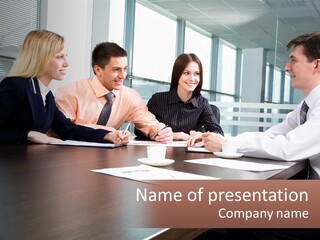 A Group Of Business People Sitting Around A Conference Table PowerPoint Template