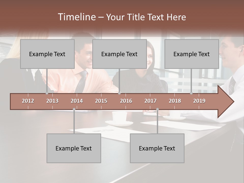 A Group Of Business People Sitting Around A Conference Table PowerPoint Template