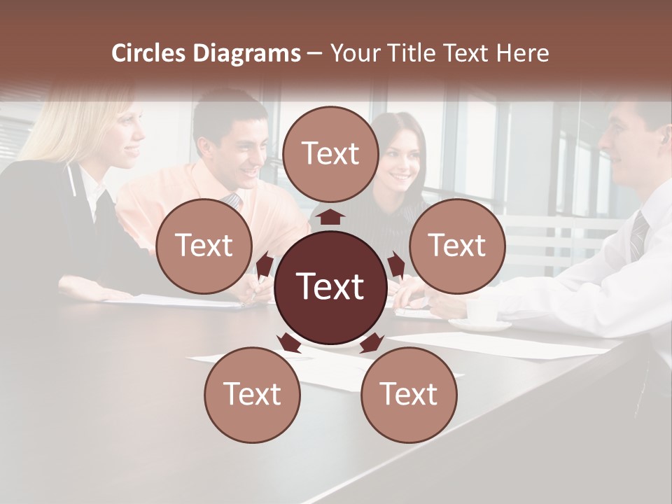 A Group Of Business People Sitting Around A Conference Table PowerPoint Template