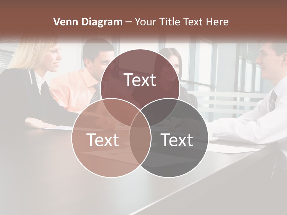 A Group Of Business People Sitting Around A Conference Table PowerPoint Template