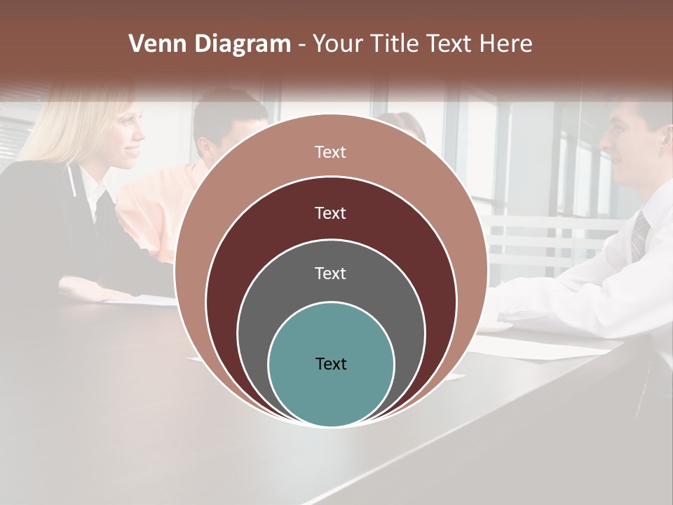 A Group Of Business People Sitting Around A Conference Table PowerPoint Template