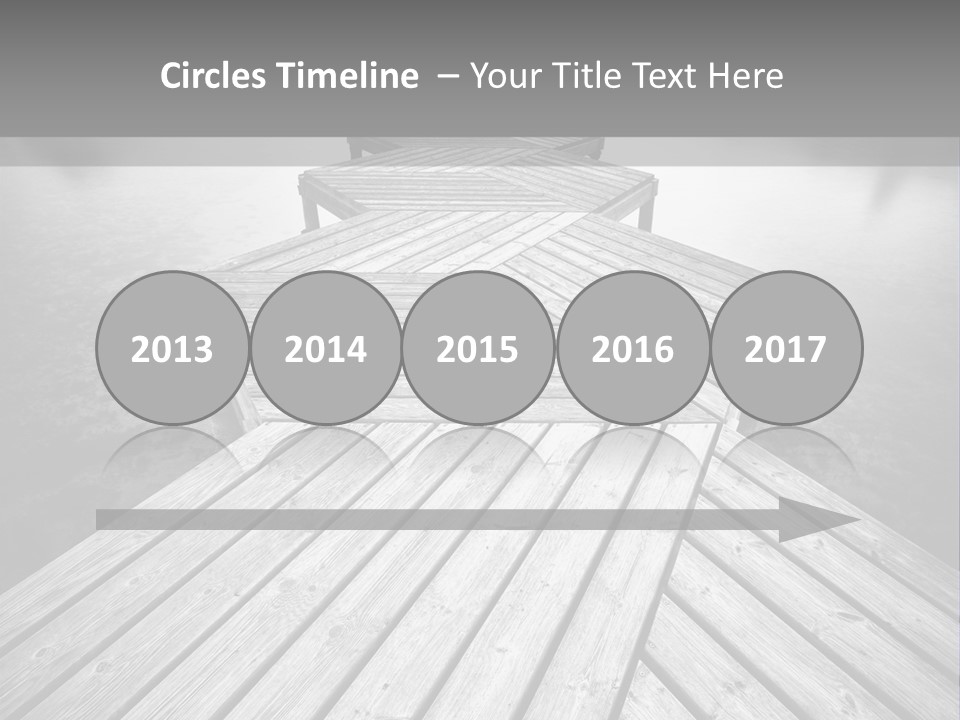 A Wooden Dock With Water And Clouds In The Background PowerPoint Template