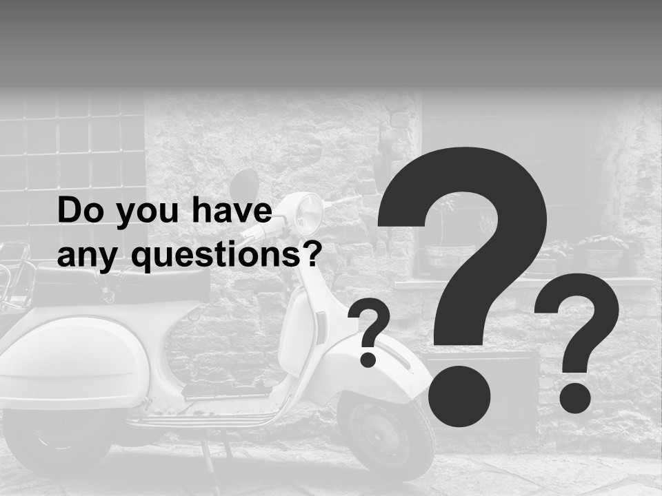 A Motor Scooter Parked In Front Of A Stone Building PowerPoint Template