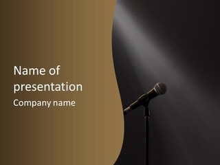 A Microphone On A Stage With A Spotlight On It PowerPoint Template
