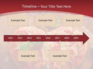 A Heart Shaped Pizza On A Cutting Board With Two Glasses Of Wine PowerPoint Template