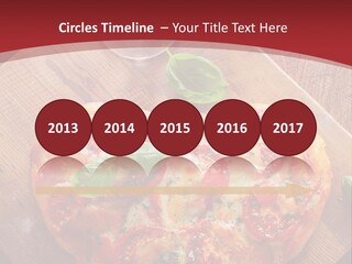 A Heart Shaped Pizza On A Cutting Board With Two Glasses Of Wine PowerPoint Template