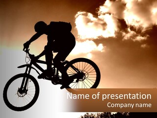A Person Jumping A Bike In The Air PowerPoint Template