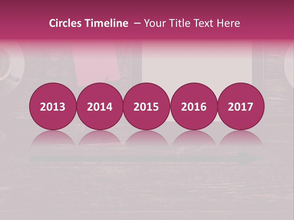 A Tablet Computer Sitting On Top Of A Wooden Table PowerPoint Template