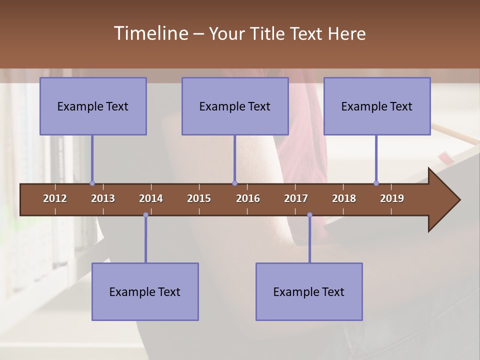 A Man Sitting In A Library Reading A Book PowerPoint Template
