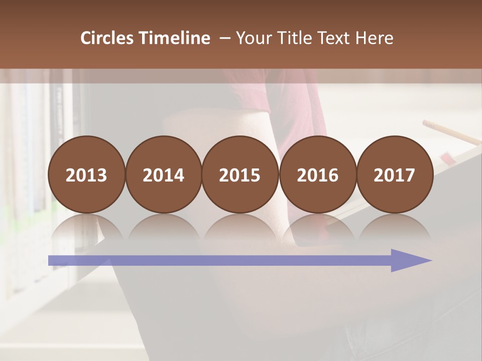 A Man Sitting In A Library Reading A Book PowerPoint Template