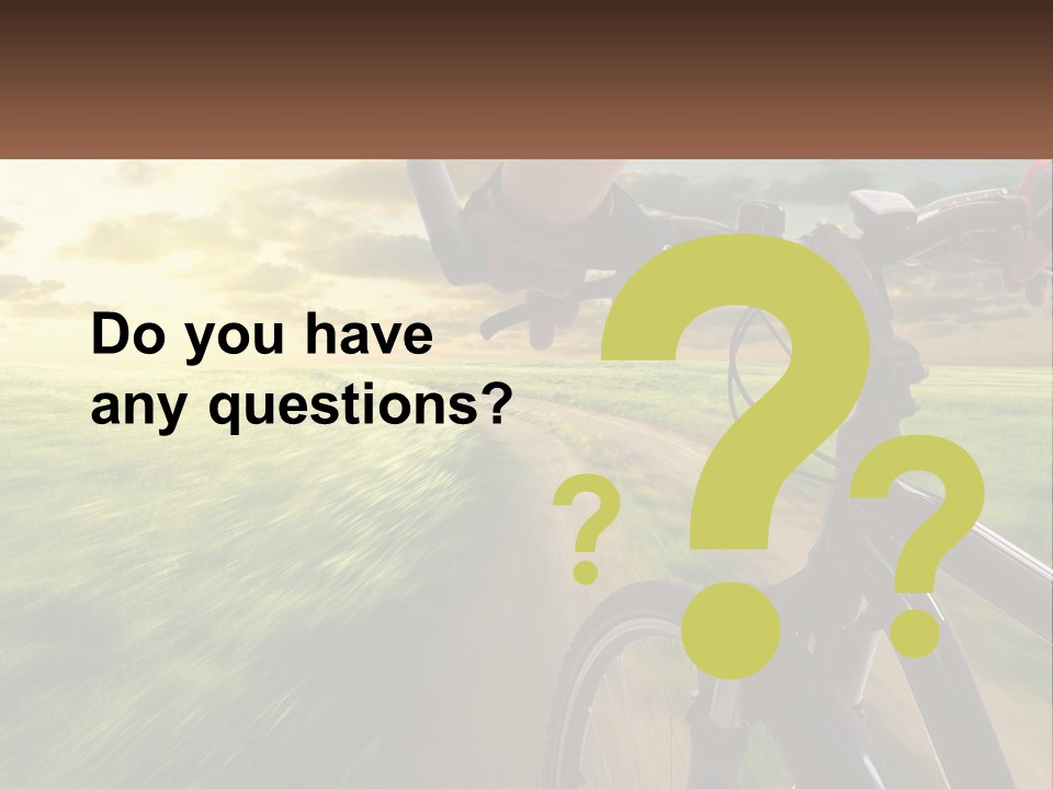 A Person Riding A Bike Down A Dirt Road PowerPoint Template