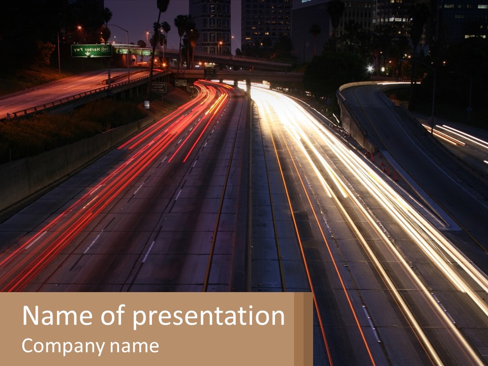 A Highway With A Lot Of Traffic Going By At Night PowerPoint Template