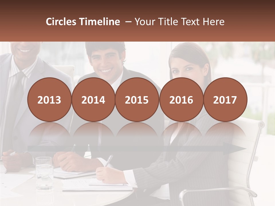 A Group Of Business People Sitting At A Table PowerPoint Template
