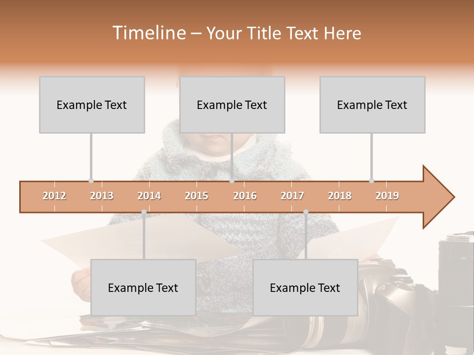 A Baby Reading A Book Next To A Camera PowerPoint Template