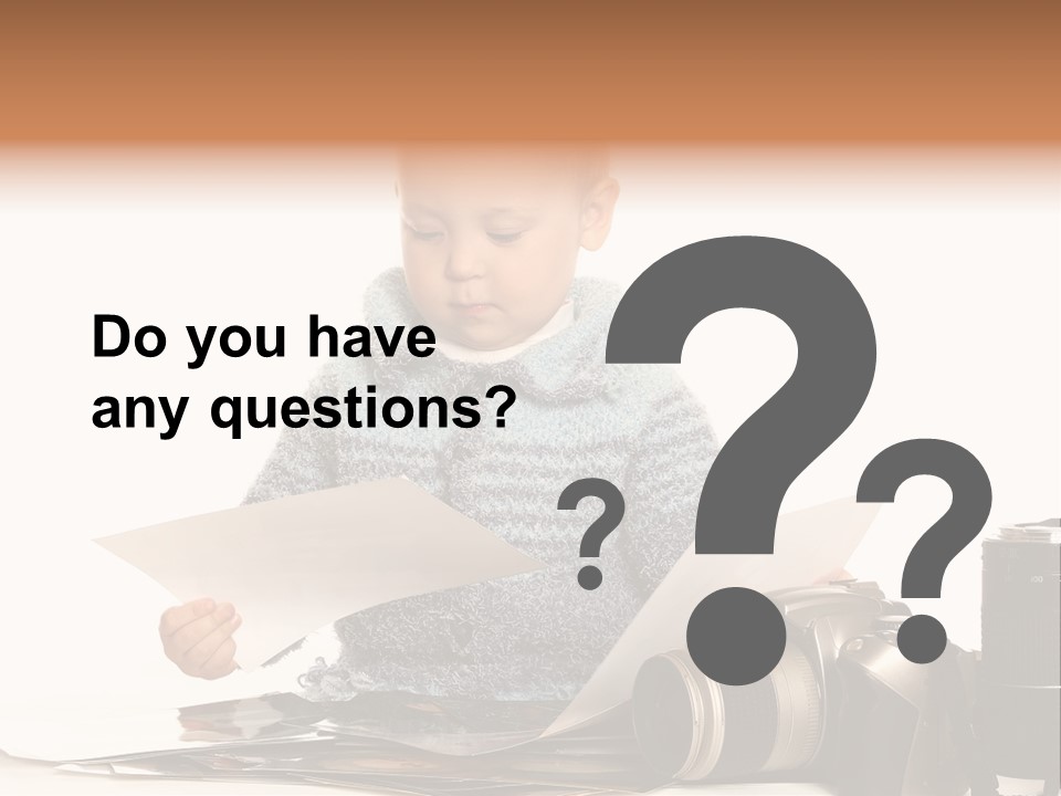 A Baby Reading A Book Next To A Camera PowerPoint Template