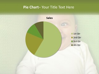 A Baby Laying On Top Of A Green Blanket PowerPoint Template