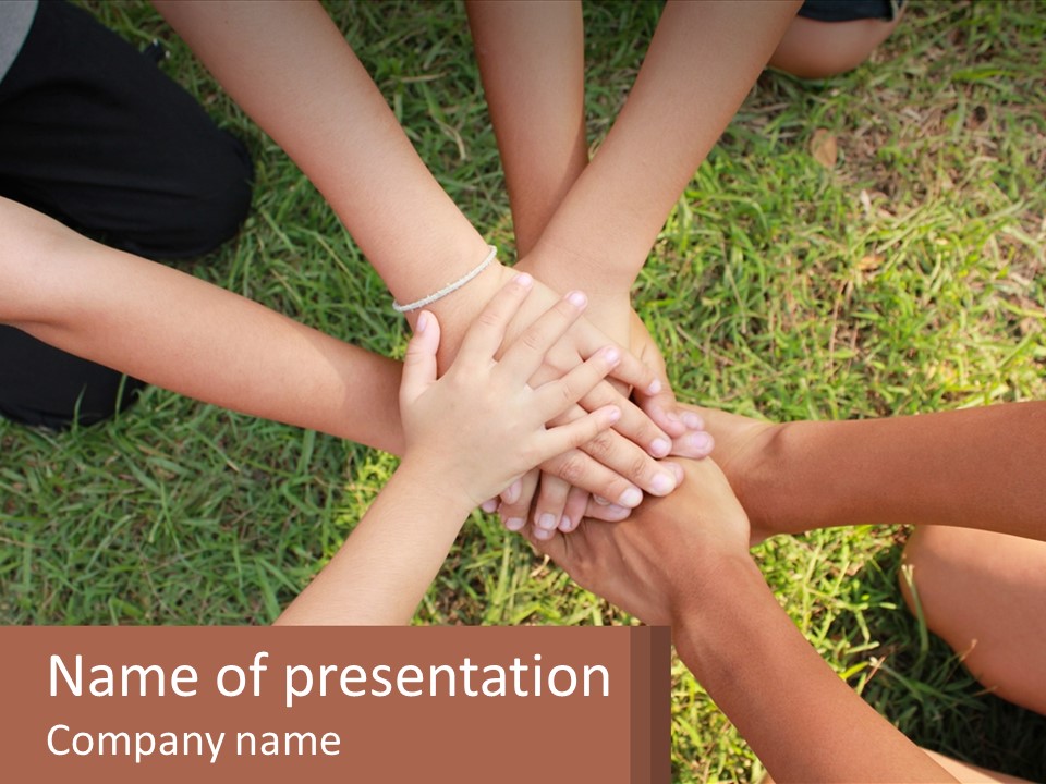 A Group Of People Putting Their Hands Together PowerPoint Template