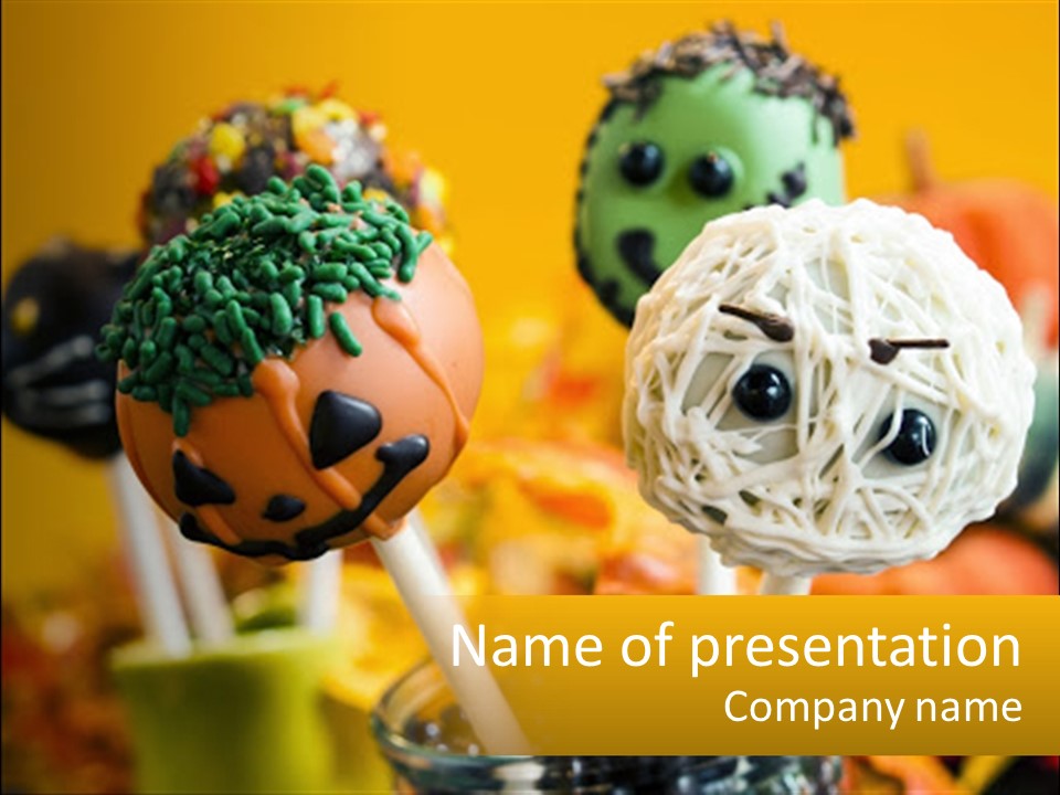 A Group Of Halloween Cake Pops With Faces On Them PowerPoint Template