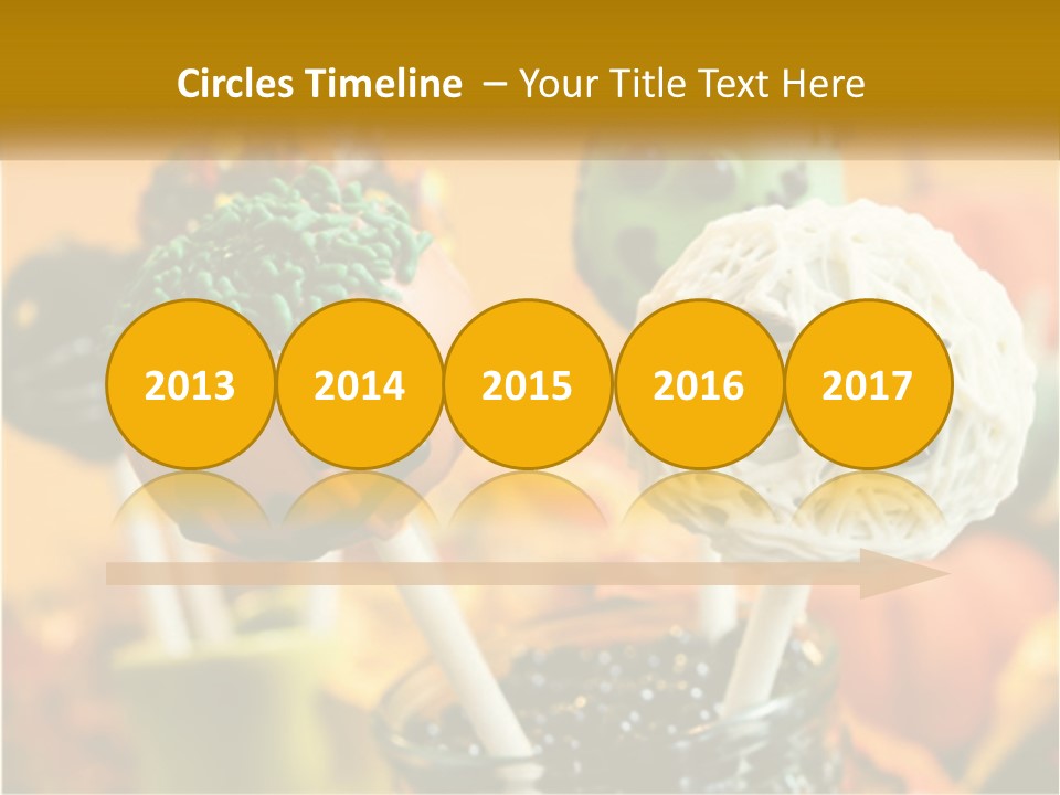 A Group Of Halloween Cake Pops With Faces On Them PowerPoint Template