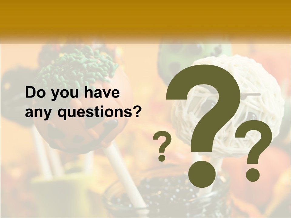 A Group Of Halloween Cake Pops With Faces On Them PowerPoint Template