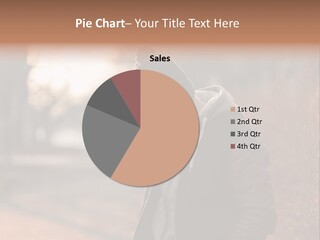A Man In A Black Jacket Is Looking At His Cell Phone PowerPoint Template