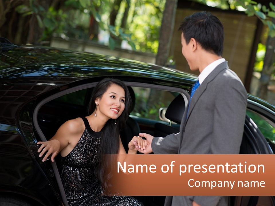 A Man In A Suit Shaking Hands With A Woman In A Car PowerPoint Template