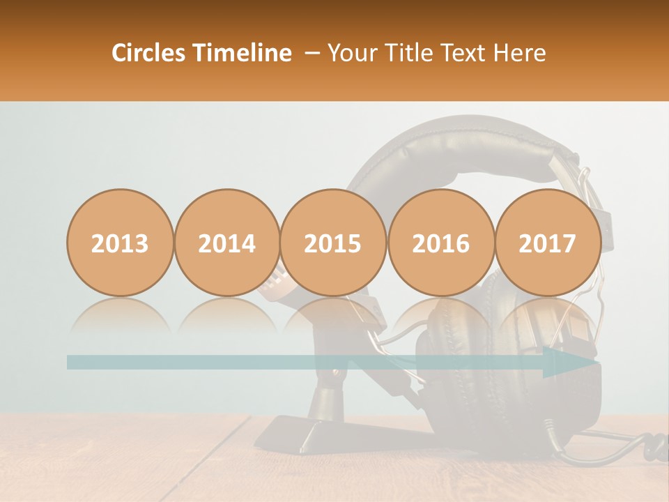 A Microphone And Headphones On A Wooden Table PowerPoint Template