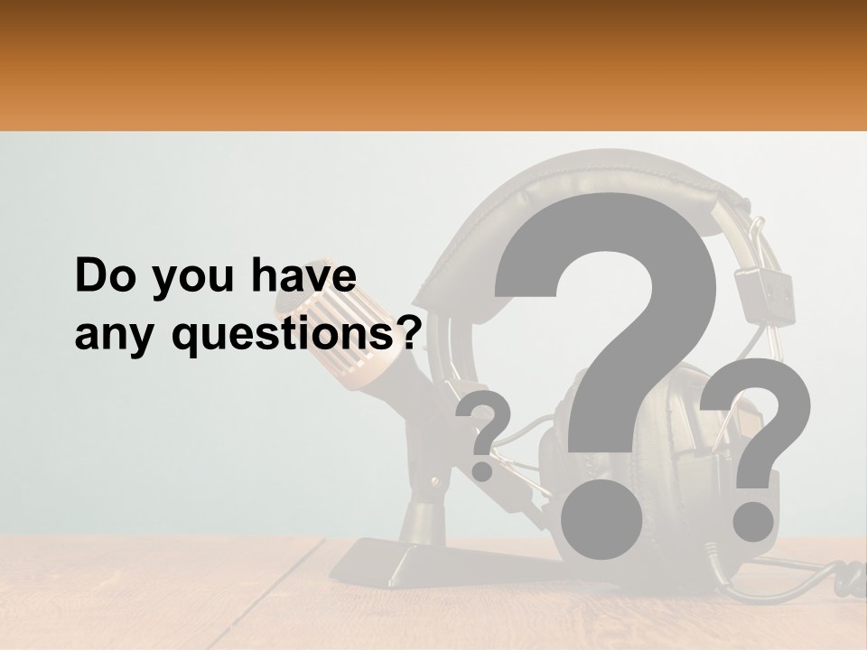 A Microphone And Headphones On A Wooden Table PowerPoint Template