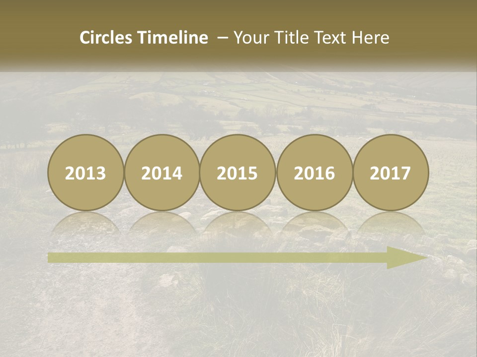 A Dirt Path In A Field With Mountains In The Background PowerPoint Template