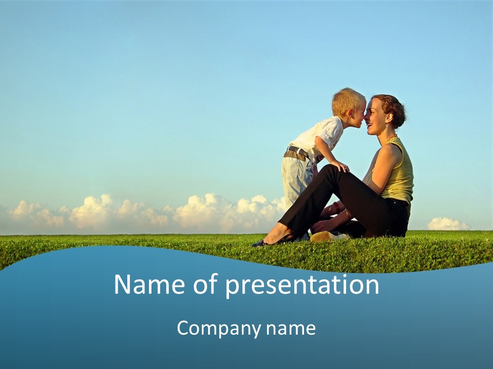 A Woman And A Child Are Sitting On The Grass PowerPoint Template