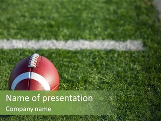 A Football Sitting On Top Of A Lush Green Field PowerPoint Template