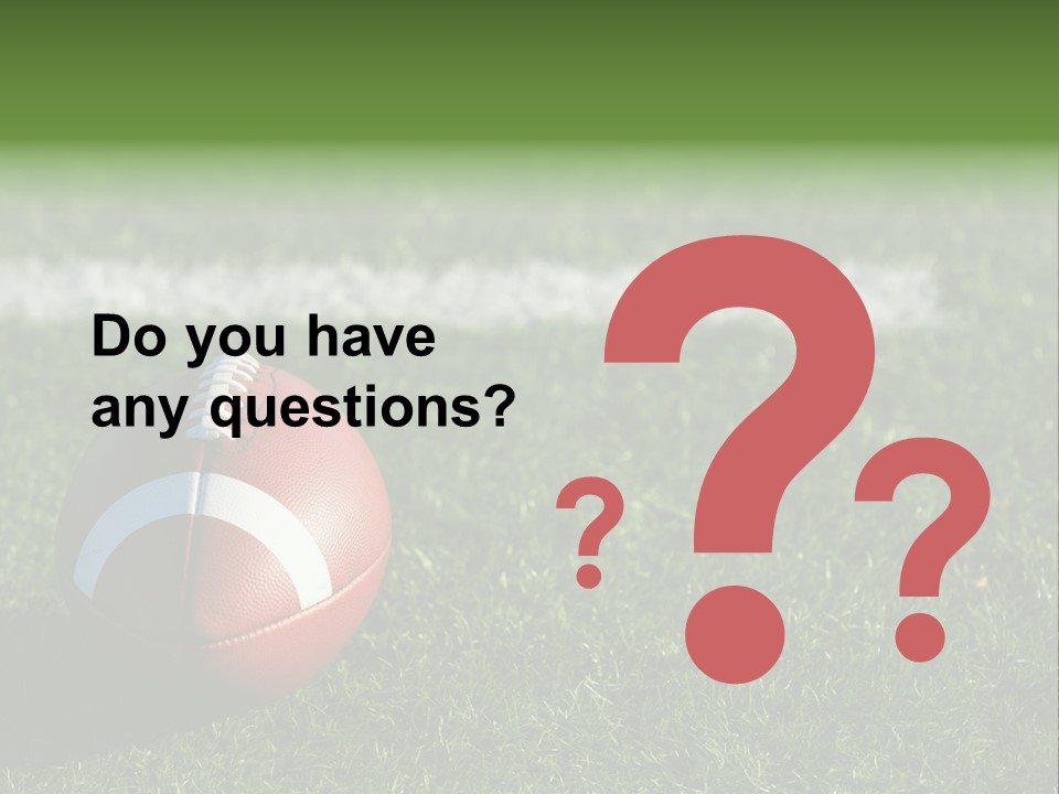 A Football Sitting On Top Of A Lush Green Field PowerPoint Template