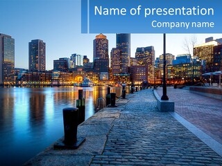 A Picture Of A City At Night With The Name Of The City PowerPoint Template