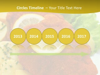 A Plate Of Food With Lemons And Lettuce On It PowerPoint Template
