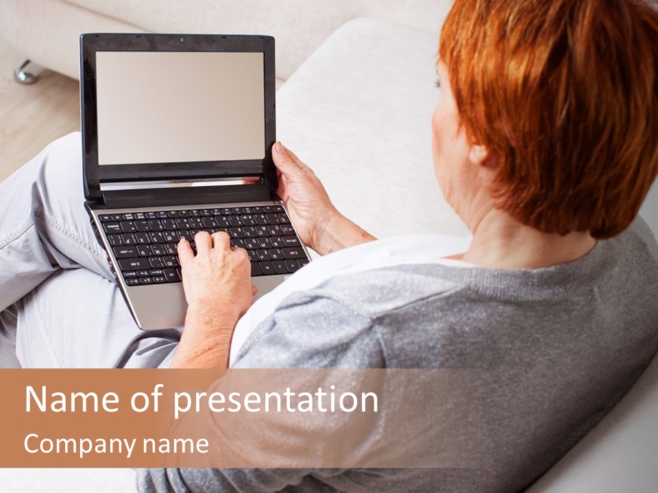 A Woman Sitting On A Couch Using A Laptop Computer PowerPoint Template