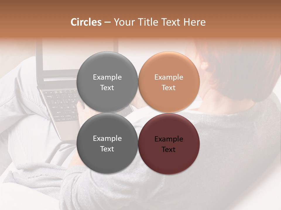 A Woman Sitting On A Couch Using A Laptop Computer PowerPoint Template