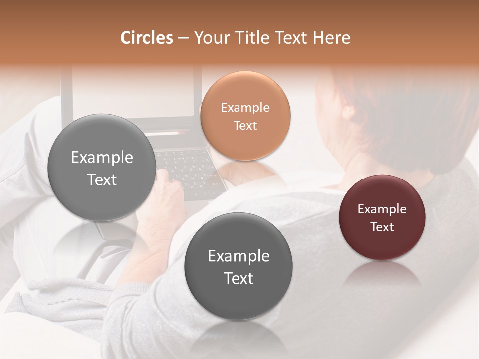 A Woman Sitting On A Couch Using A Laptop Computer PowerPoint Template