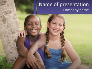 Two Young Girls Sitting Next To Each Other Under A Tree PowerPoint Template