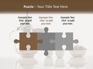 A Silver Tea Pot And Cups On A Table PowerPoint Template