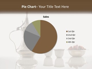 A Silver Tea Pot And Cups On A Table PowerPoint Template