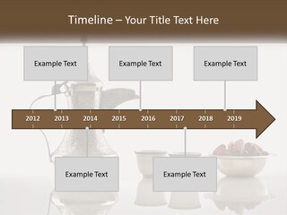 A Silver Tea Pot And Cups On A Table PowerPoint Template