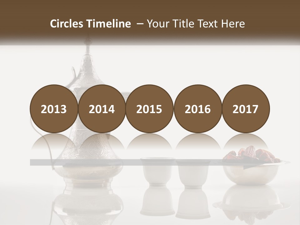 A Silver Tea Pot And Cups On A Table PowerPoint Template